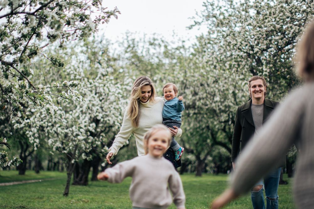 Happy Texas family of four smiling together outdoors